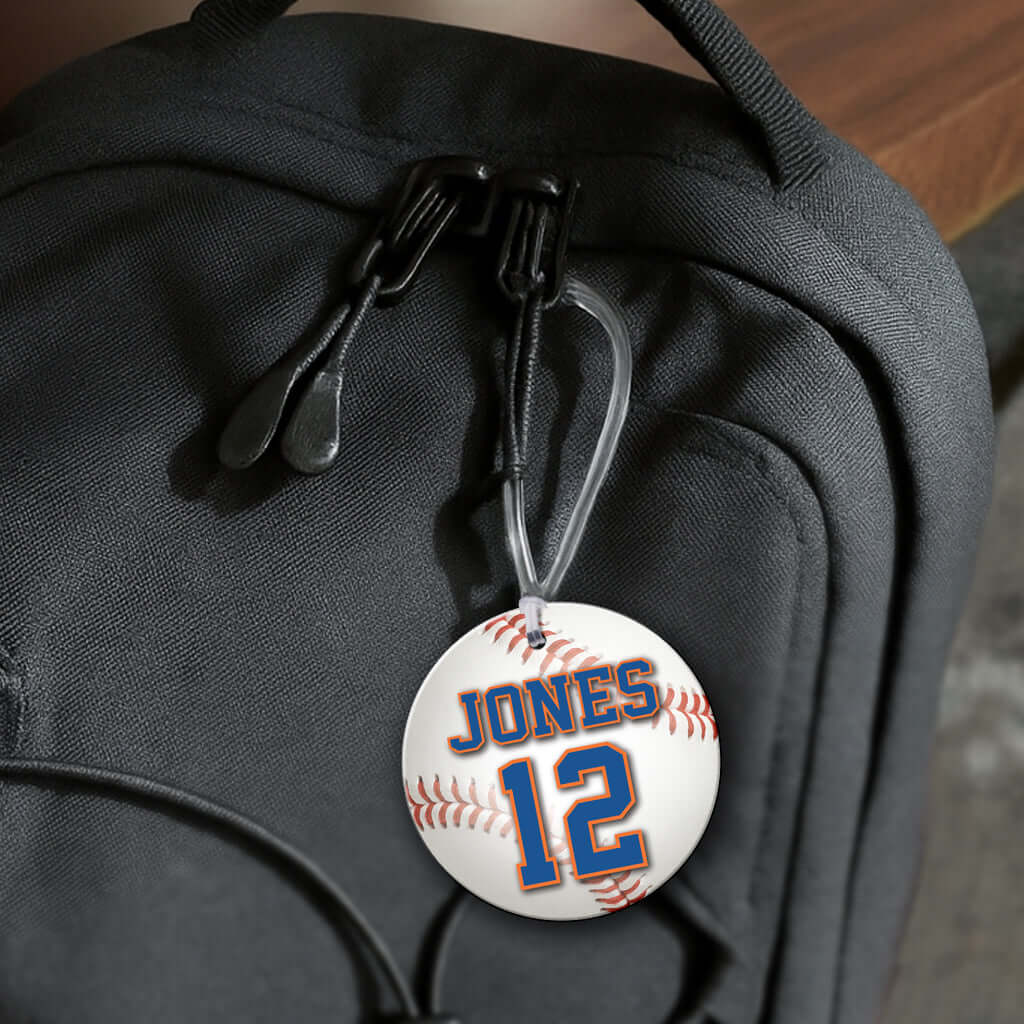 Personalized metal baseball hang tag ornament. 3.5″, includes name and number