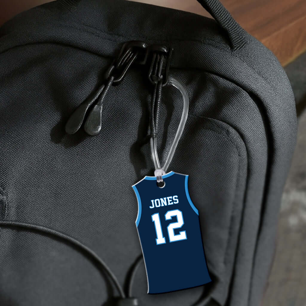 Personalized metal basketball jersey hang tag ornament. 3.5″, includes name and number