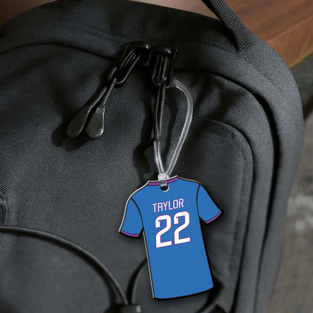 Personalized metal soccer jersey hang tag ornament. 3.5″, includes name and number