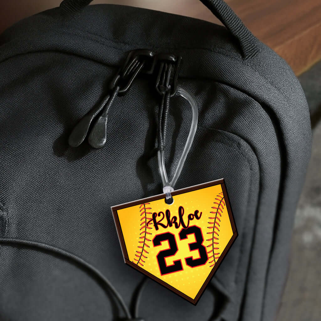 Personalized metal home plate hang tag ornament for softball. 3.5″, includes name and number