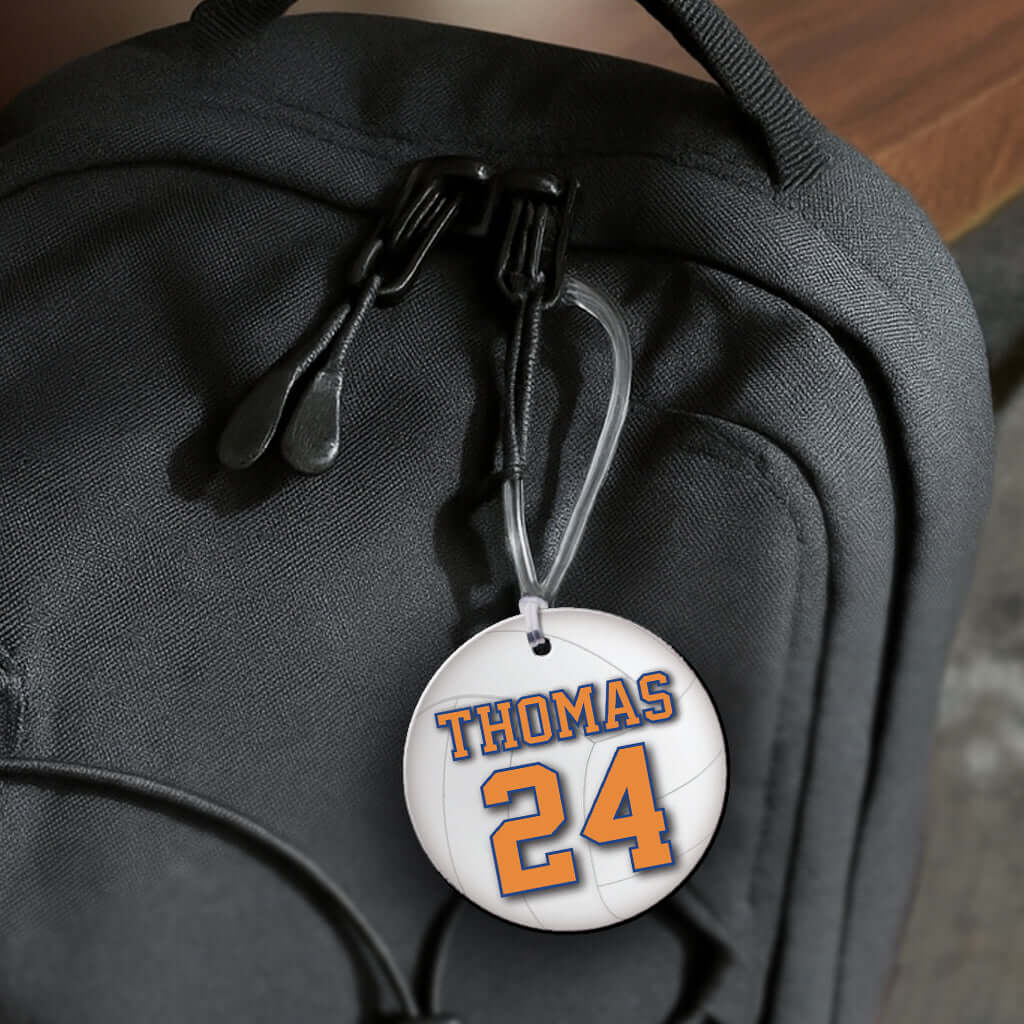 Personalized metal volleyball hang tag ornament. 3.5″, includes name and number