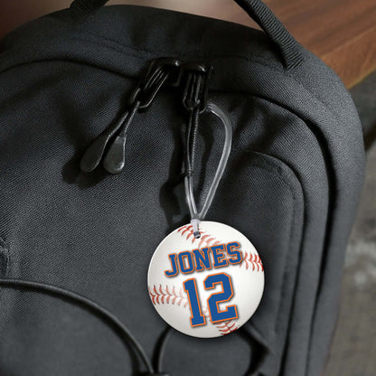 Personalized metal baseball hang tag ornament. 3.5″, includes name and number