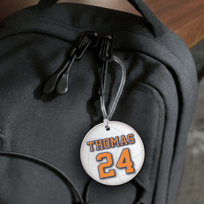 Personalized metal volleyball hang tag ornament. 3.5″, includes name and number